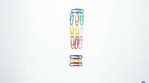 Colored paper clips that take the shape of hearts and words. Stock Footage 151699609