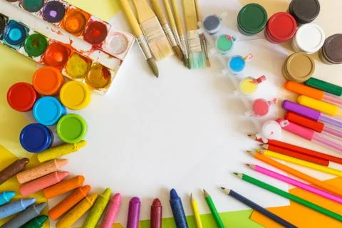 Colored paper, felt-tip pens, pencils, brushes and gouache frame Stock Photos