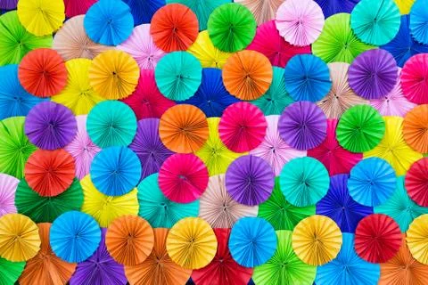 Colored paper, folded in a circle ornamental decorated background. Stock Photos