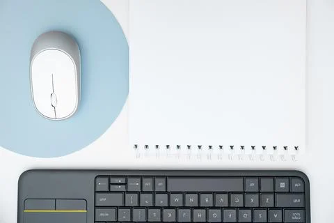 Colored paper with important message lying desk near keyboard. Main information Stock Photos