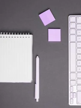 Colored paper with important message lying desk near keyboard. Main information Stock Photos