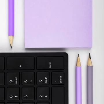Colored paper with important message lying desk near keyboard. Main information Stock Photos