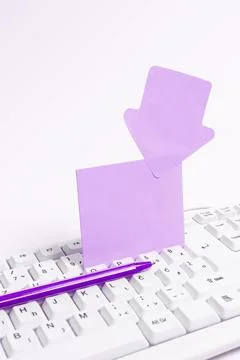 Colored paper with important message lying desk near keyboard. Main information 스톡 사진