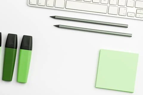 Colored paper with important message lying desk near keyboard. Main information Stock Photos