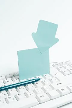 Colored paper with important message lying desk near keyboard. Main information Stock Photos