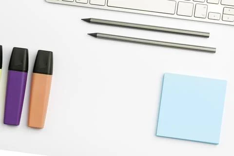 Colored paper with important message lying desk near keyboard. Main information Stock Photos