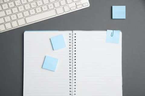 Colored paper with important message lying desk near keyboard. Main information Stock Photos