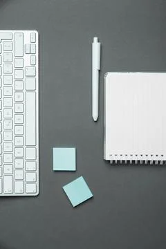 Colored paper with important message lying desk near keyboard. Main information Stock Photos
