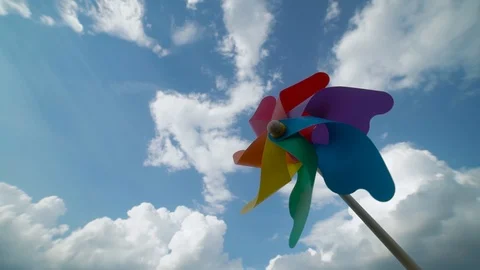 Colored paper screw rotates against a blue sky,slow motion 库存影片 126796457