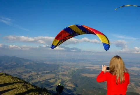 Colored Paraglider taking off from Pico Agudo in Santo Antonio do Pinhal, S.. Stock Photos