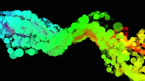 Colored particles of different shapes move slowly on a black background. Abstrac Stock Footage 123061144