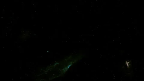 Colored particles suspended in the backg... | Stock Video | Pond5