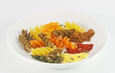 Colored pasta on the plate Stock Photos