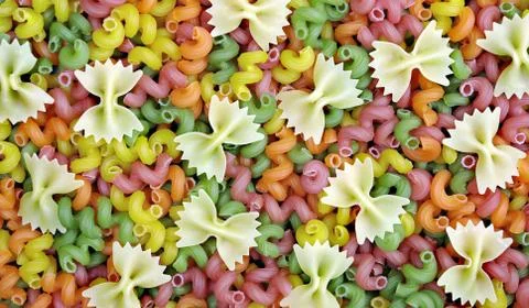 Colored pasta texture background. close up Stock Photos