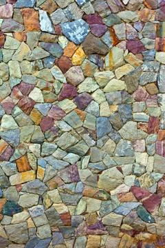 Colored pattern of old stone wall surfaced Stock Photos