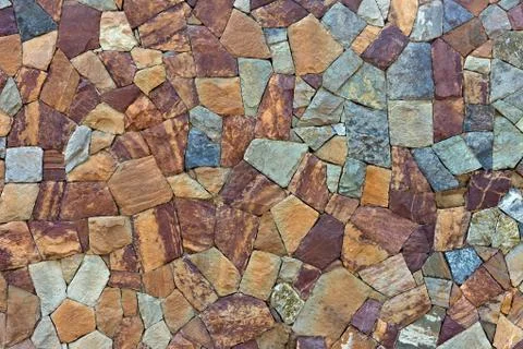 Colored pattern of old stone wall surfaced Stock Photos