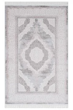 Colored patterned machine carpet on a white background Stock Photos