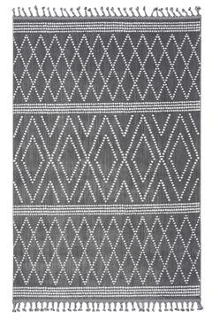 Colored patterned machine carpet on a white background Stock Photos