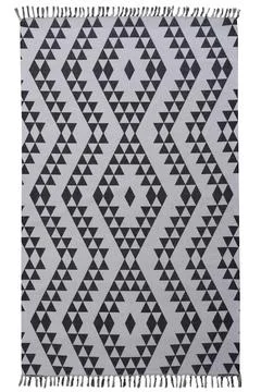 Colored patterned machine carpet on a white background Stock Photos