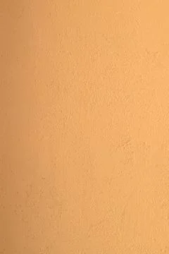 Colored peach wall. Texture. Background. Stock Photos