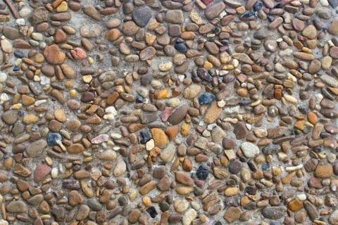 Colored pebbles on the surface Stock Photos