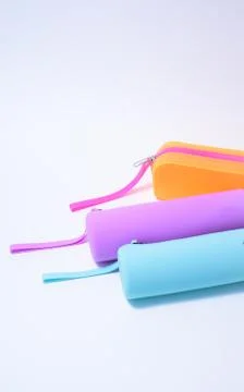 Colored pencil cases on a white background Stock Photos