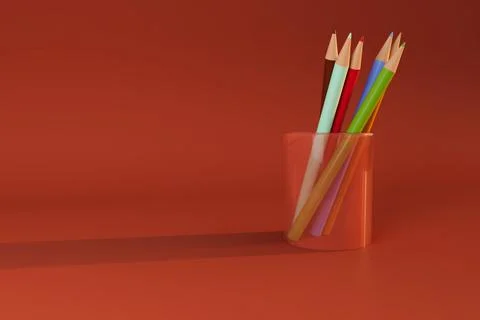 Colored pencil in transparent cup on red background Ilustración de archivo