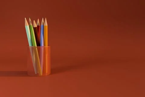 Colored pencil in transparent holder on red background Stock Illustration