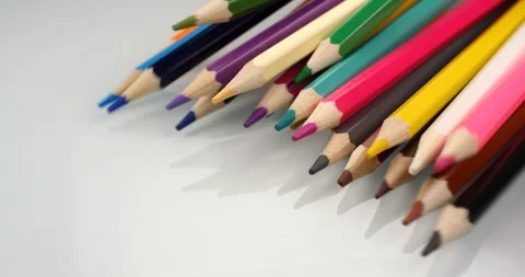Colored pencils appear on white background. Close up view, shot on RED 6K camera Video stock 107914697
