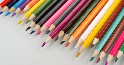 Colored pencils appear on white background. Close up view, shot on RED 6K camera Stock Footage 107918469