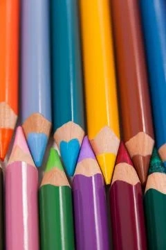 Colored pencils arranged in interlock pattern Foto stock