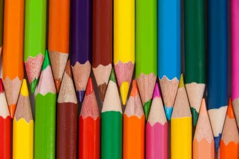 Colored pencils arranged in interlock pattern Stock Photos