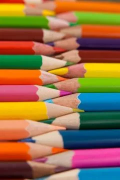 Colored pencils arranged in interlock pattern Stock Photos