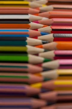 Colored pencils arranged in interlock pattern Foto stock