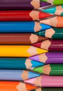 Colored pencils arranged in interlock pattern Stock Photos