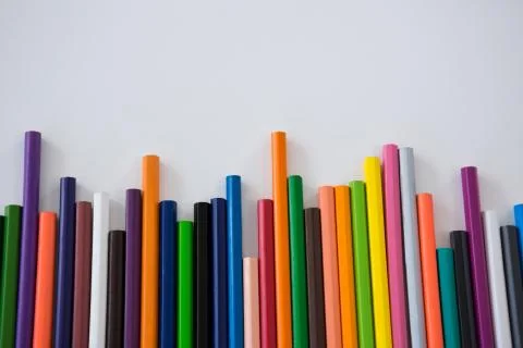 Colored pencils arranged in a wavy pattern Stock Photos