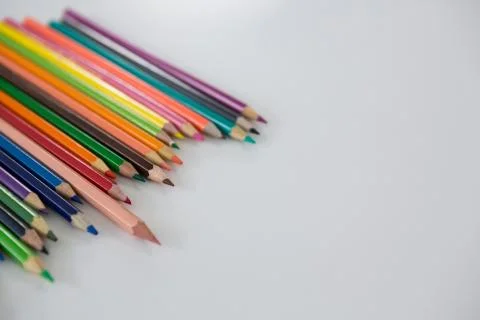 Colored pencils arranged in a wavy pattern Stock Photos
