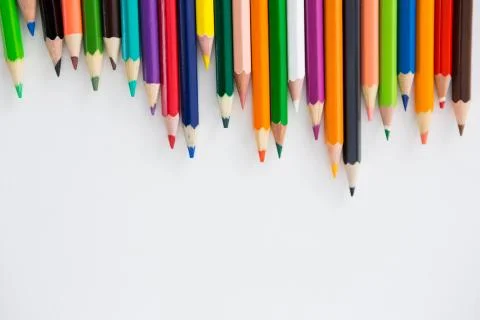 Colored pencils arranged in a wavy pattern Stock Photos