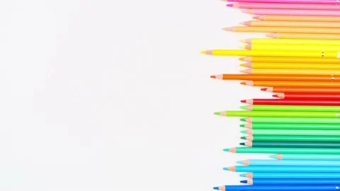 Colored pencils arranged on white background extend up and back. Top view. Stop Stock Footage 153108352