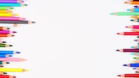 Colored pencils arranged on white background extend up and back. Top view. Stop Stock Footage 153616664