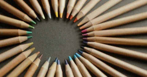 Colored pencils on black background, closeup, rotating Stock Footage 79180273