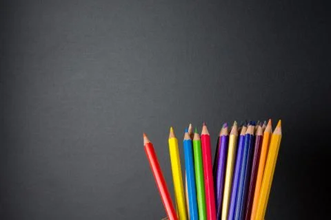 Colored pencils on blackboard  background, back to school concept Stock Photos