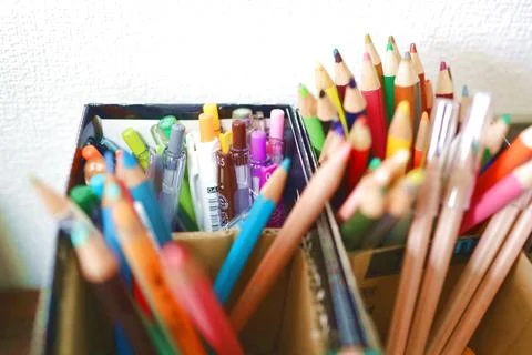 Colored pencils in a box Stock Photos