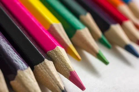 Colored pencils close-up on a white background, for backgrounds and texture,  Stock Photos