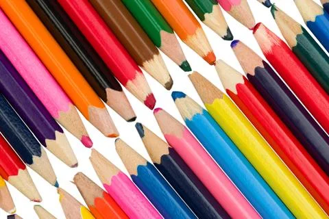Colored pencils on a diagonal, touching in the middle on a white background Stock Photos
