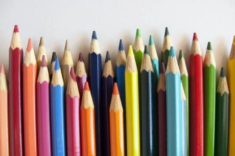 Colored pencils of different sizes, close-up Stock Photos