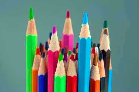 Colored pencils for drawing on a gray background. Education and creativity. L Stock Photos