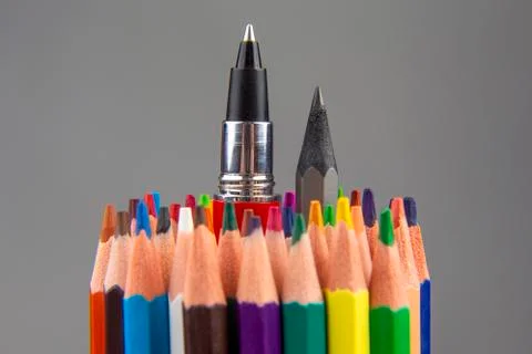 Colored pencils for drawing on a gray background. Education and creativity. L Stock Photos