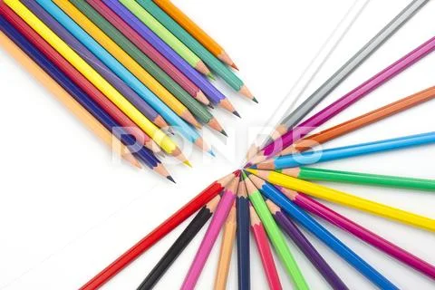 Colored pencils for drawing on a white background. Education and creativity. Stock Photos
