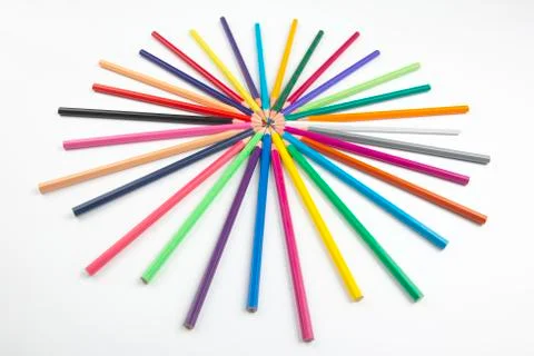Colored pencils for drawing on a white background. Education and creativity.  Stock Photos